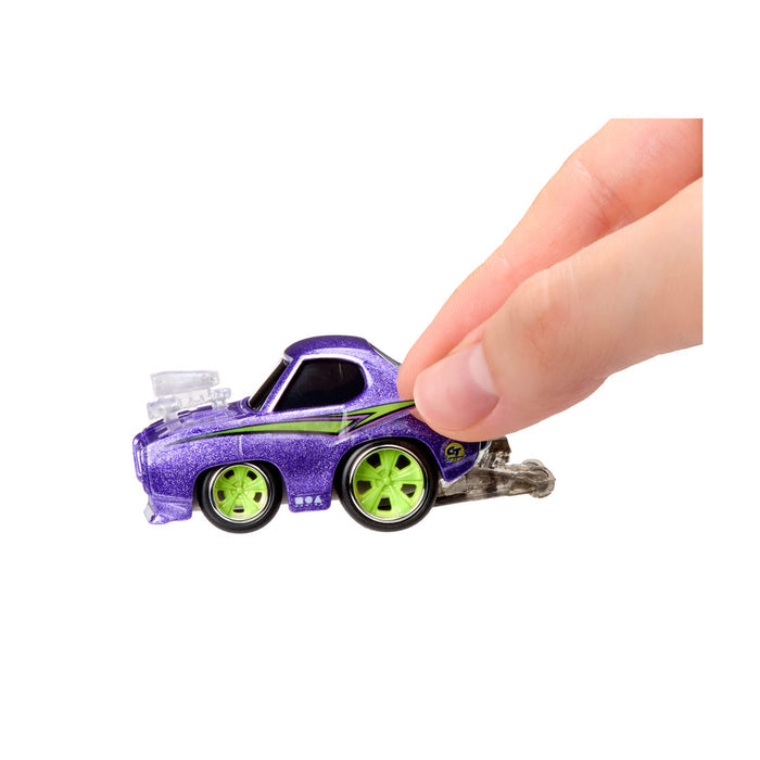 Fingers gripping the backend of the purple car on a white background
