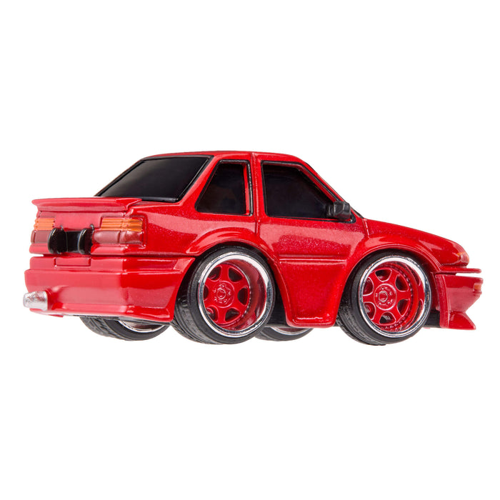 Red toy car on a white background