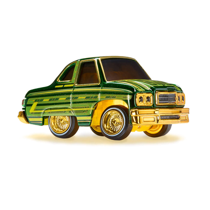Green and gold toy car on a white background