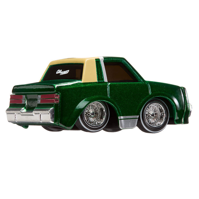 Model car with a green body and beige roof on a white background