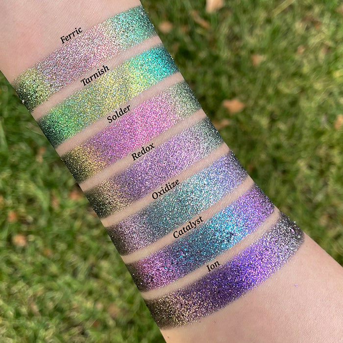 Arm swatches of Ferric, Tarnish, Solder, Redox, Oxidize, Catalyst and Ion on fair skin tone.