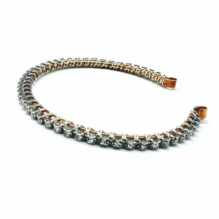 Catch-Free Crystal Rhinestone Tennis Bracelet Bangle on a white background with shining rhinestones and a copper base.