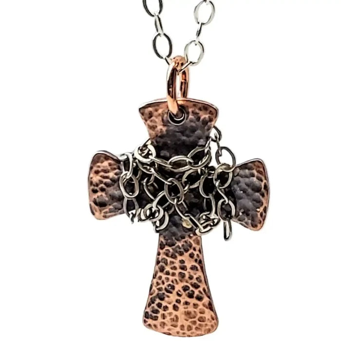 Chained Hammered Copper Cross Necklace For Him Or Her showcasing a unique hand-hammered design with intricate chain accents.