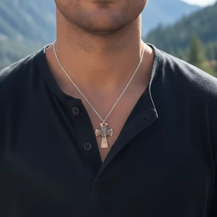 Chained Hammered Copper Cross Necklace For Him Or Her worn by a man outdoors, showcasing spiritual craftsmanship.