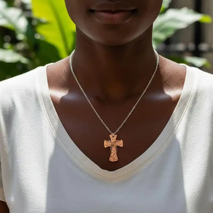 Chained Hammered Copper Cross Necklace For Him Or Her worn by a model, showcasing its artisan craftsmanship and spiritual design.