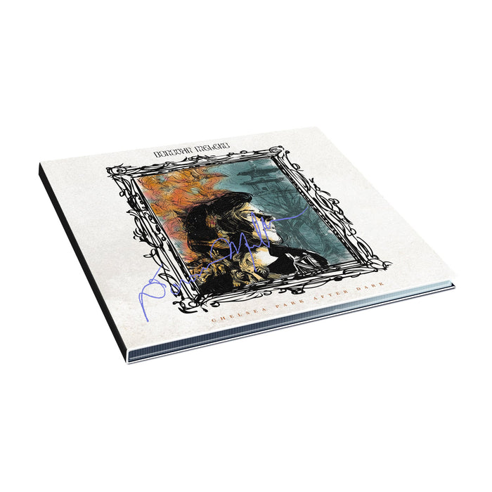 Signed CD with a drawing of a picture frame in the middle. Inside the frame, there is a person looking to the side. Inside the frame, the background colors are half yellow and half blue. Above the frame, there is text that says DONOVAN MELERO. Below the frame, there is small text that says CHELSEA PARK AFTER DARK.