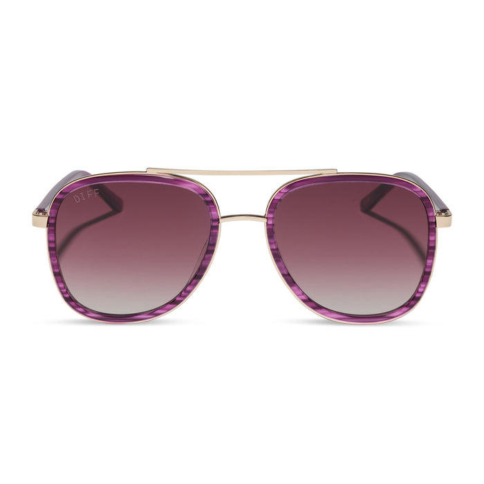 diff eyewear x disney alice in wonderland cheshire cate oversized navigator sunglasses with a purple frame and pink gradient lenses front view