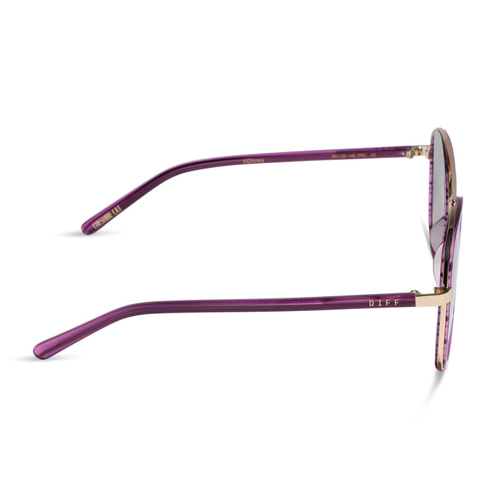 diff eyewear x disney alice in wonderland cheshire cate oversized navigator sunglasses with a purple frame and pink gradient lenses side view