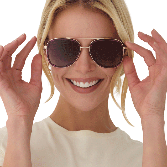 on model - animated image of female putting on diff eyewear x disney alice in wonderland cheshire cate oversized navigator sunglasses
