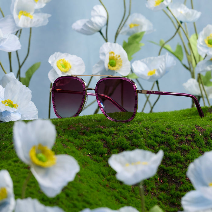 still life - diff eyewear x disney alice in wonderland cheshire cate oversized navigator sunglasses in a garden