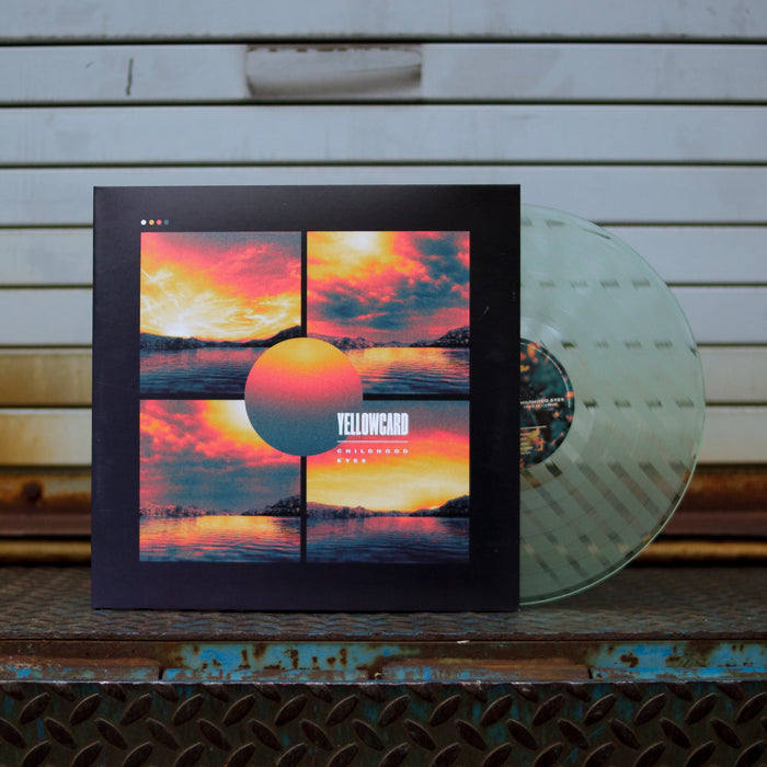 Photo of the LP and jacket. It is being propped up in front of a warehouse gate.