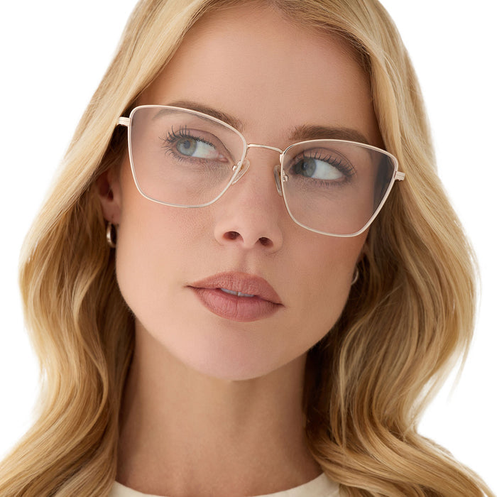 on model - female wearing diff eyewear featuring the connie cat eye prescription glasses with a gold frame front view