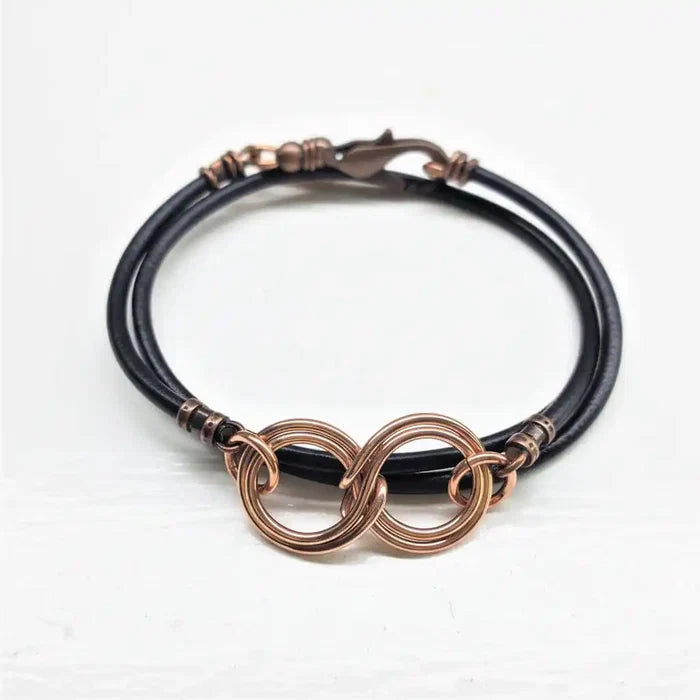 Copper Double Infinity Gender Neutral Leather Wrap Bracelet featuring hand-formed copper infinity symbols on black leather cord.