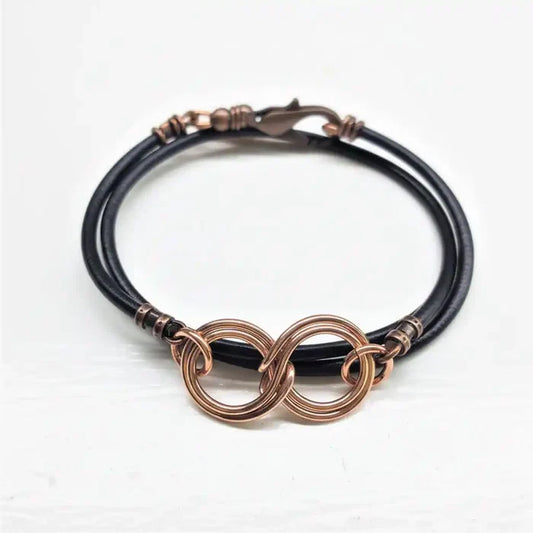 Copper Double Infinity Gender Neutral Leather Wrap Bracelet featuring hand-formed copper infinity symbols on black leather cord.