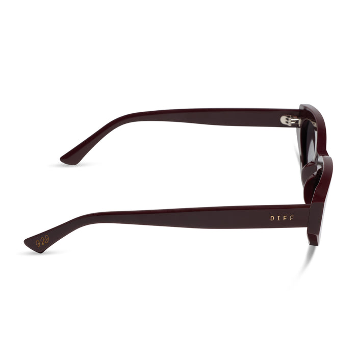 diff eyewear x jessie james decker crystal cat eye sunglasses with a burgundy red acetate frame and grey gradient polarized lenses side view
