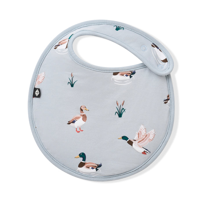 Front of the Cushy Bib in Mallard Duck with the black Kyte baby logo visible