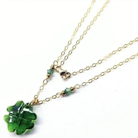 Dark Green Sparkly Crystal Lucky Clover Necklace featuring a carved clover bead and delicate gold chain.