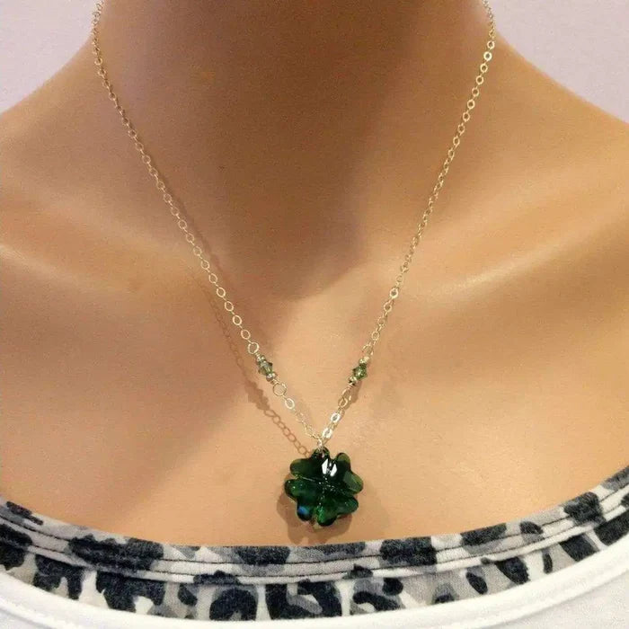 Dark Green Sparkly Crystal Lucky Clover Necklace displayed on a mannequin, featuring a carved dark green clover bead.