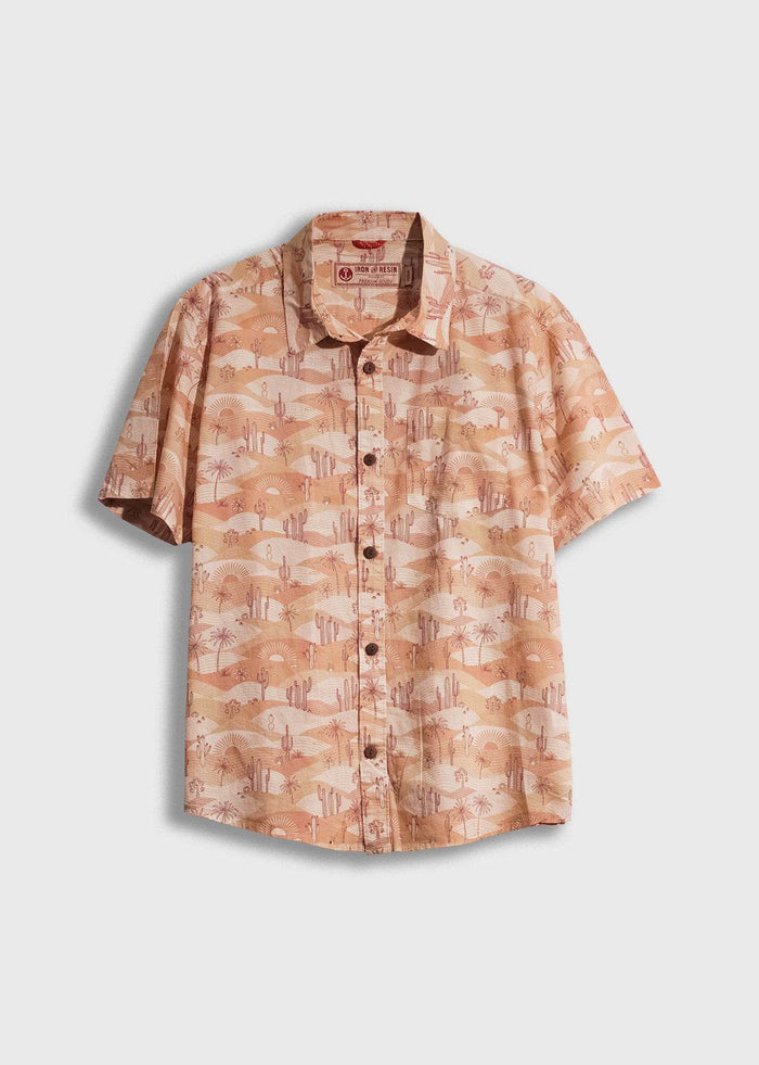 Short-sleeve shirt with desert landscape print, featuring cacti and sun motifs. Light brown tones, button-up front.