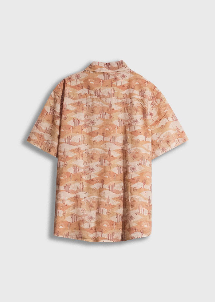 Back view of a short-sleeve shirt with a desert landscape pattern, featuring cacti and sun motifs in warm, earthy tones.