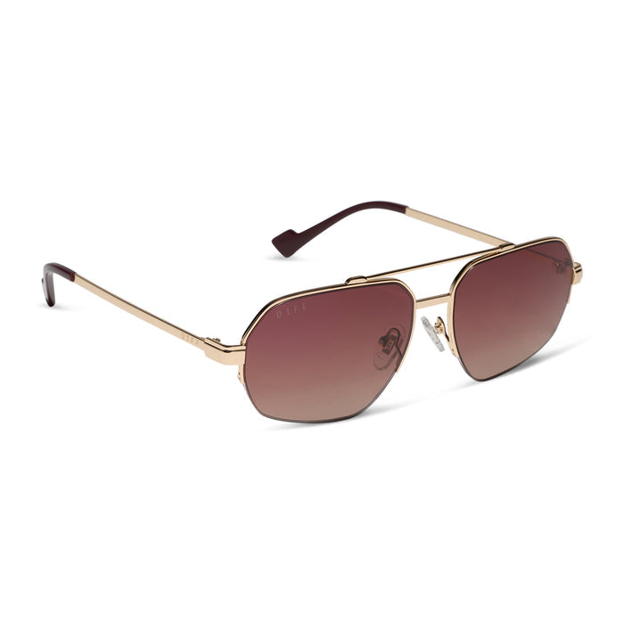 diff eyewear x jessie james decker destiny navigator sunglasses with a gold metal frame and dusk gradient lenses angled view