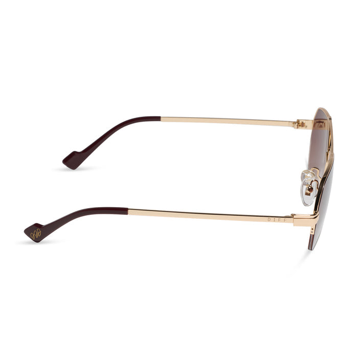 diff eyewear x jessie james decker destiny navigator sunglasses with a gold metal frame and dusk gradient lenses side view
