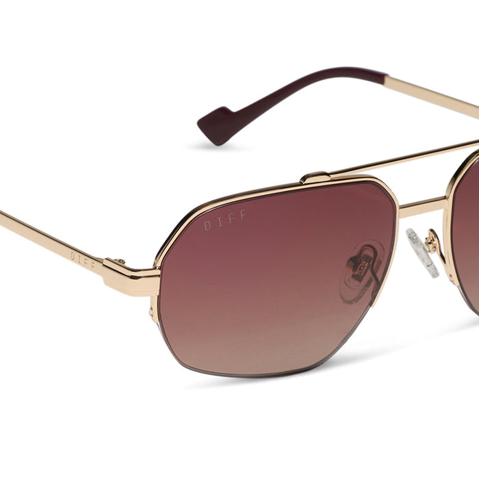 diff eyewear x jessie james decker destiny navigator sunglasses with a gold metal frame and dusk gradient lenses detailed view