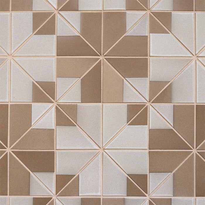 Caption: Dual Glaze 4" Triangles in DG11 Natural Manganese Blend. Light Smoke grout by Custom Building Products.