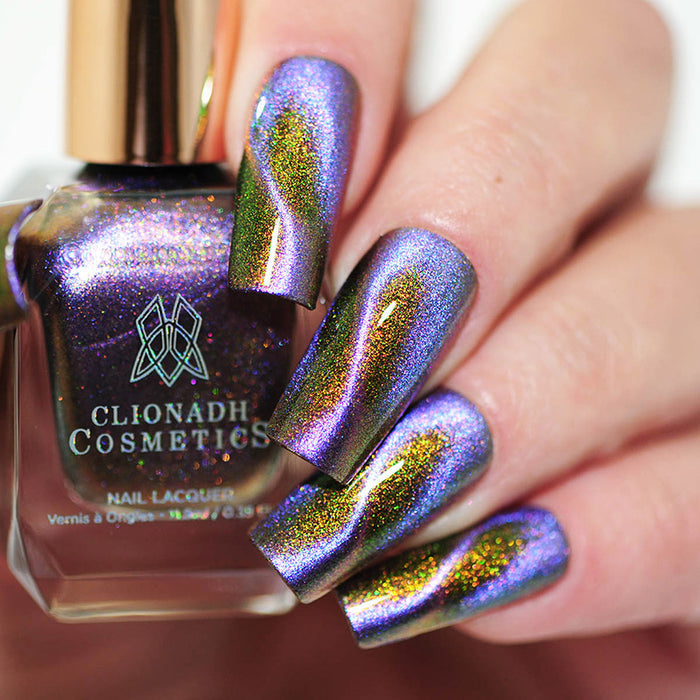 Close up of nails done with DIstortion nail lacquer featuring a swirl magnetic effect on fair skin tone