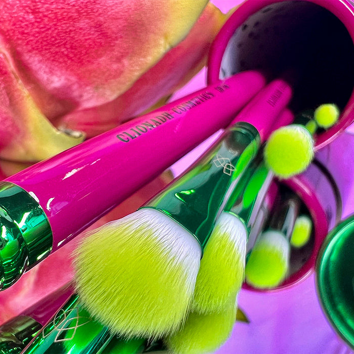 Close up top angled Dragon Fruit Brush set peaking out of housing tube