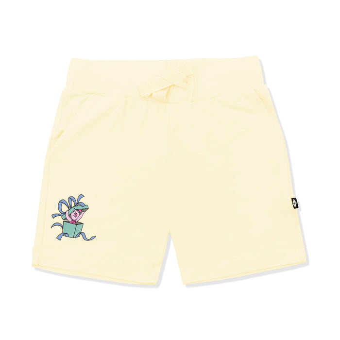 Light yellow drawstring shorts with winnie the pooh piglet character the left leg