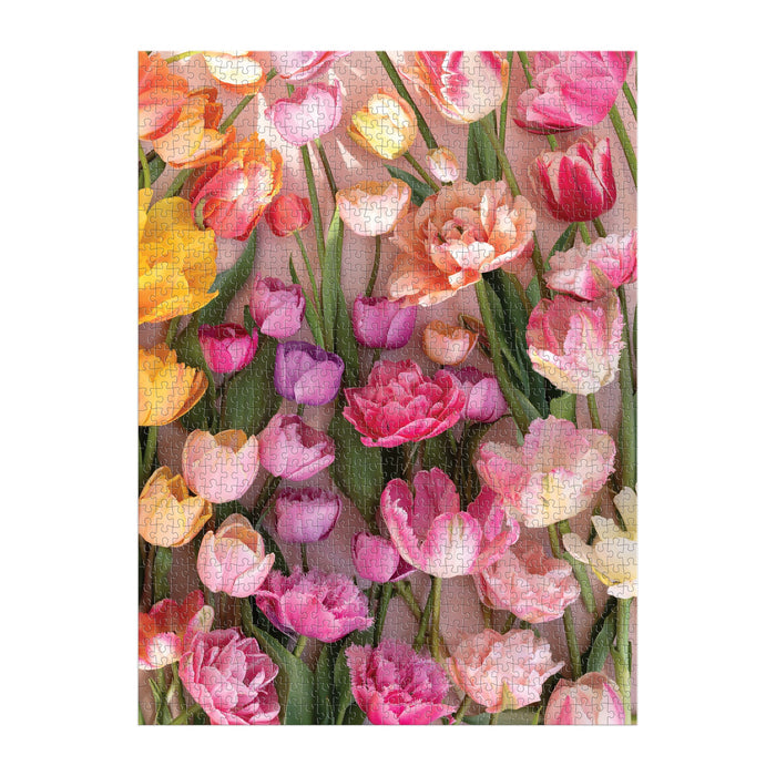 The Ephemeral Tulips 1000 Piece Puzzle by Christine Chitnis showcases a vibrant floral pattern with pink, purple, yellow, and peach tulips among green leaves.