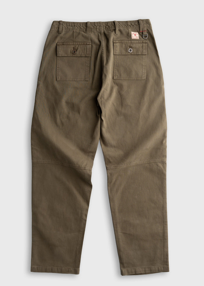 Brown work pants with two back pockets and a small red logo tag, displayed on a light background, showcasing durable fabric.