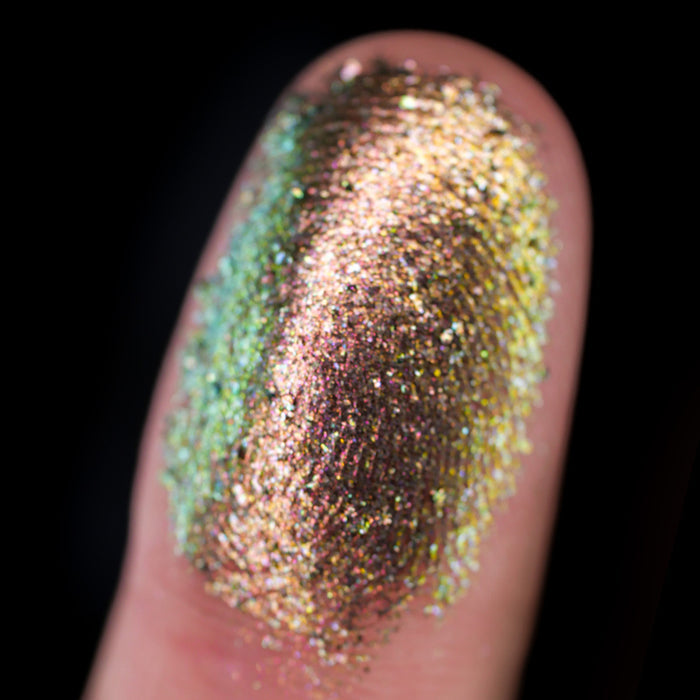 Macro finger swatch of Ferric Dimensional Multichrome on fair skin tone.