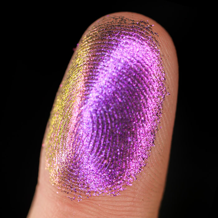 Macro finger swatch of Flame-Blown Lite on fair skin tone.