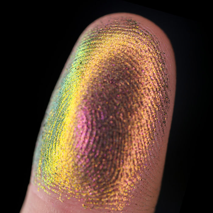Macro finger swatch of Forge Lite on fair skin tone.