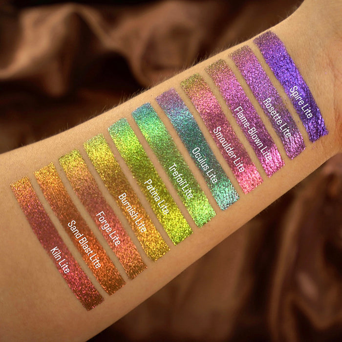 Arm swatches of Forge Lite as well as the other Jewelled Lites on fair skin tone.