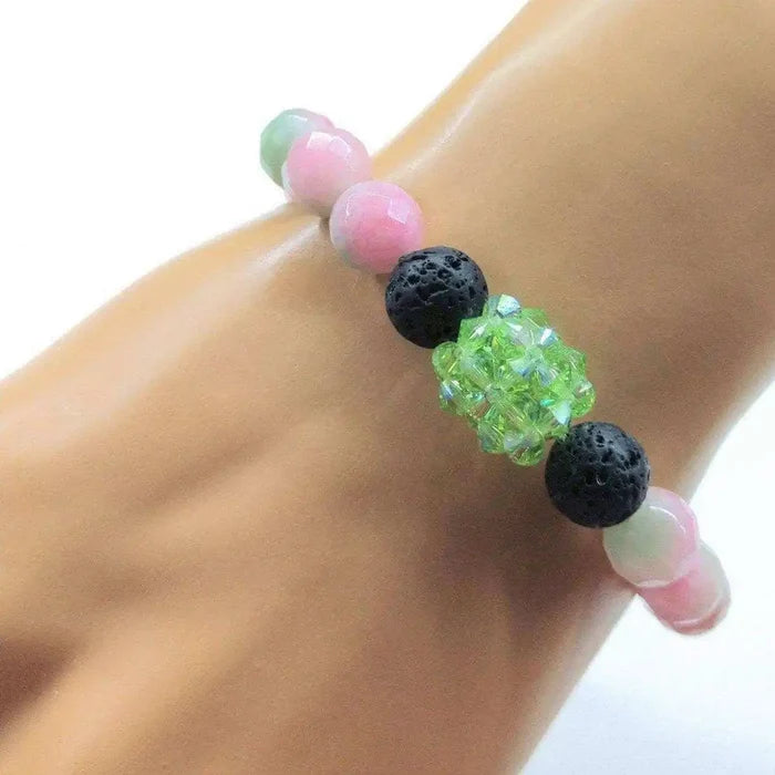 Gem Packed Watermelon Jade Crystal Lava Rock Bracelet featuring pink jade and black lava rock beads.