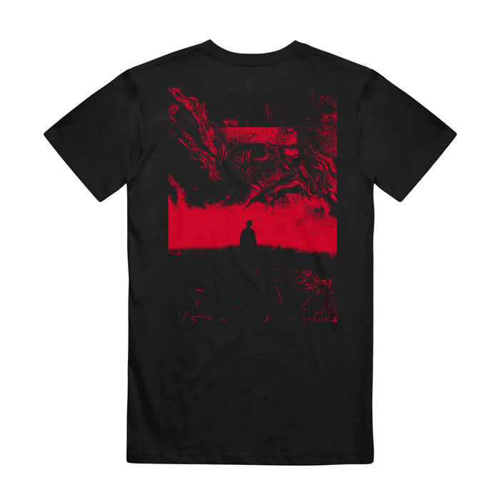 Back of shirt has picture of person's silhouette and swirls and shapes are above and below them. The picture is in black and red and covers most of the back of the shirt.