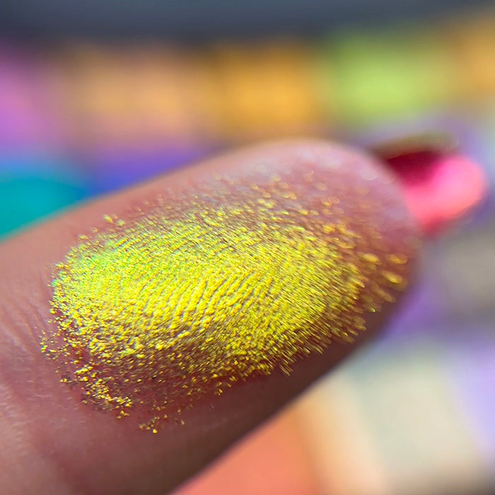 Macro finger swatch of Goblet Electric Multichrome Pigment.