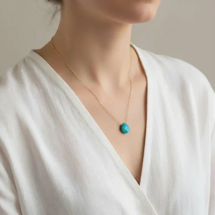 Gold Filled Aqua Jade Wire Wrap Gemstone Drop Necklace worn by a model, showcasing its elegant design and aqua jade drop.