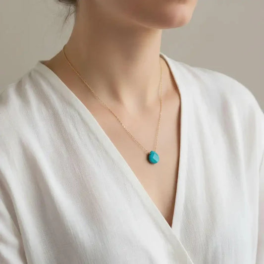 Gold Filled Aqua Jade Wire Wrap Gemstone Drop Necklace worn by a model, showcasing its elegant design and aqua jade drop.