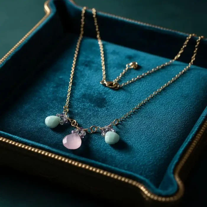 Gold Filled Light Pink and Mint Chalcedony Chain Necklace displayed on a velvet background with mint green and pink stones.