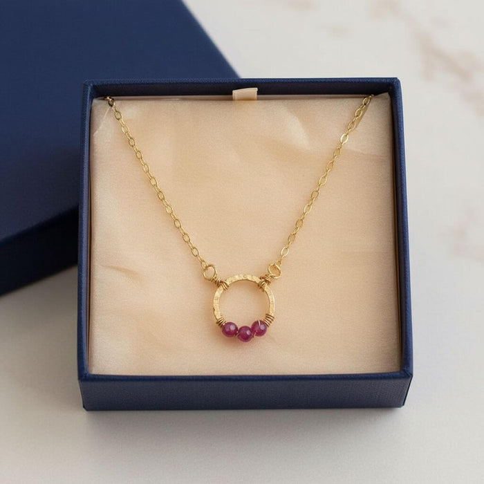 Gold Filled Pink Chalcedony Open Circle Necklace displayed in a gift box, showcasing its elegance and design.