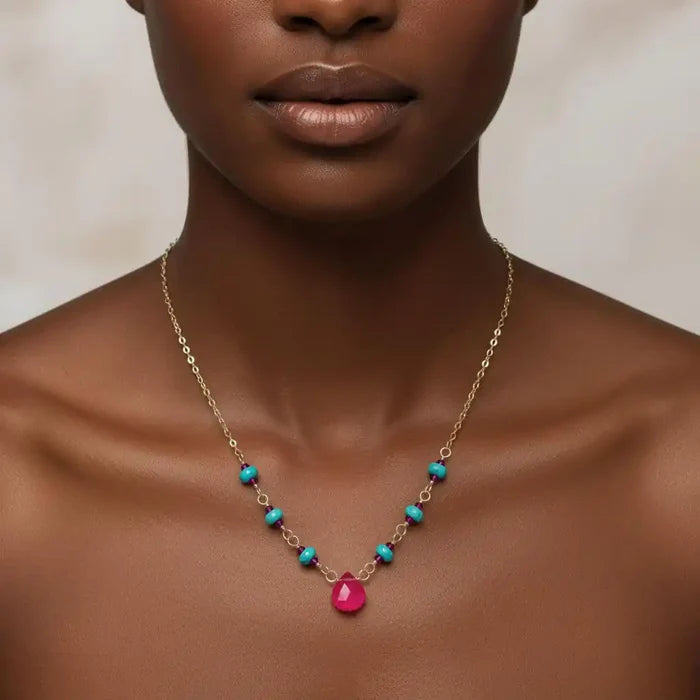 Gold Filled Pink Chalcedony Turquoise Gemstone Drop Necklace showcased on a model's neckline with a vibrant pink gemstone.