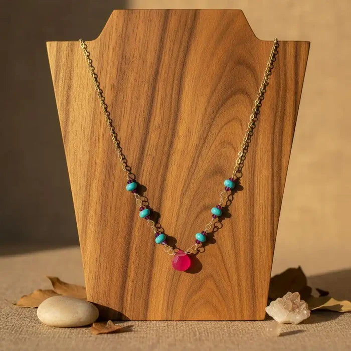 Gold Filled Pink Chalcedony Turquoise Gemstone Drop Necklace displayed on a wooden bust with vibrant gemstones.