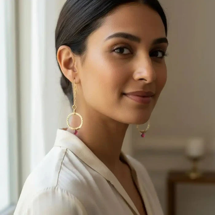 Gold Filled Wrapped Pink Chalcedony Open Circle Earrings worn by a woman, showcasing their elegance and vibrant color.