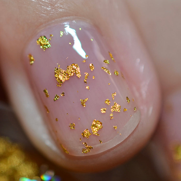Close up shot of one nail done with Golden Prairie Nail Lacquer on fair skin tone.