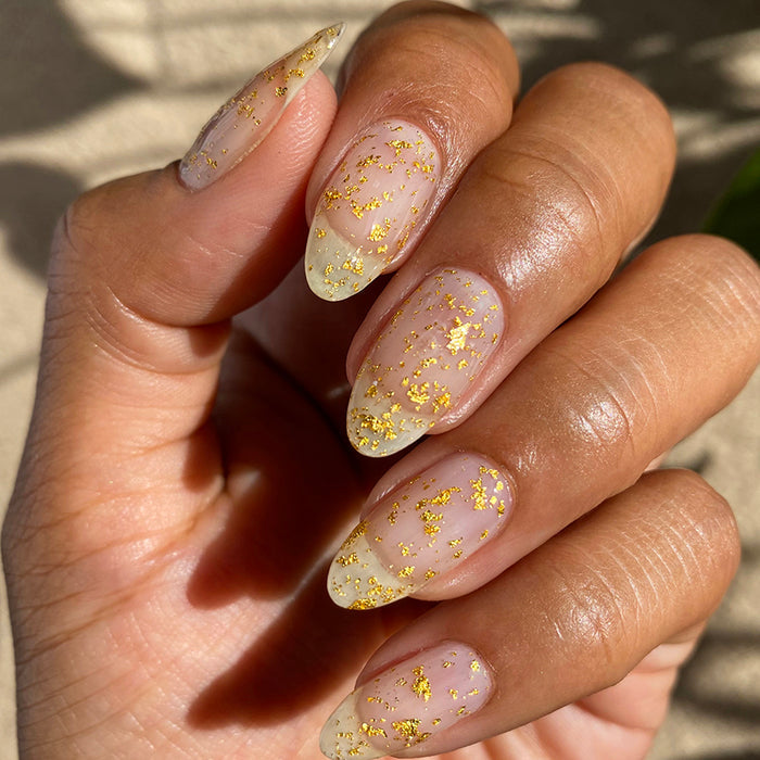 Close up shot of nails done with Golden Prairie Nail Lacquer on medium skin tone.