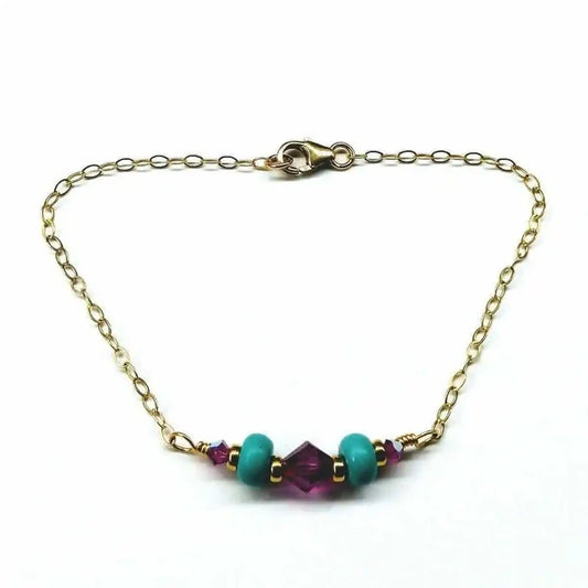Handmade Gold Filled Pink Turquoise Gemstone Bracelet featuring turquoise beads and fuchsia Swarovski crystals.